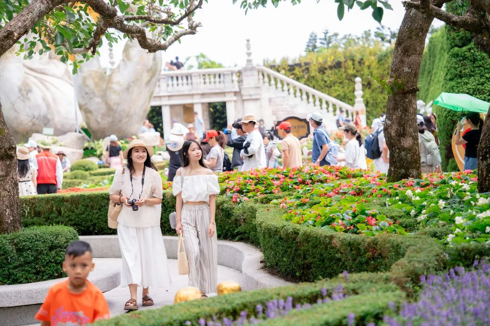 Young visitors walking through the gardens at Sun World Ba Na Hills